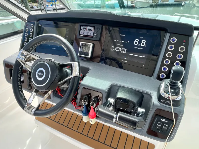 Slide: The Image of 2021 Chaparral 300 OSX helm with advanced navigation systems. - 29