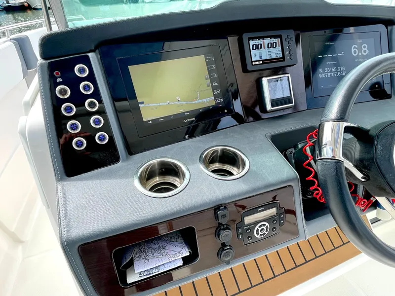 Slide: The Image of 2021 Chaparral 300 OSX cockpit with advanced navigation systems. - 31