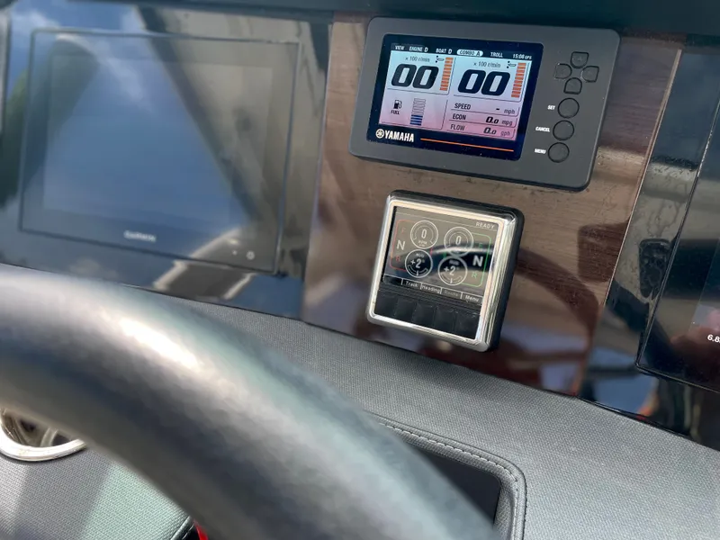 Slide: The Image of Dashboard of 2021 Chaparral 300 OSX with Yamaha displays. - 33