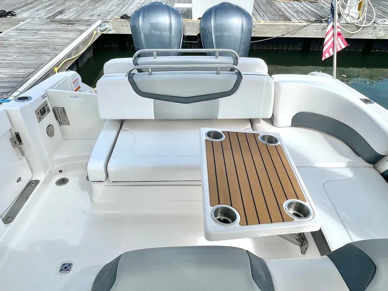 Slide: The Image of Interior of 2021 Chaparral 300 OSX with table and seating area. - 40