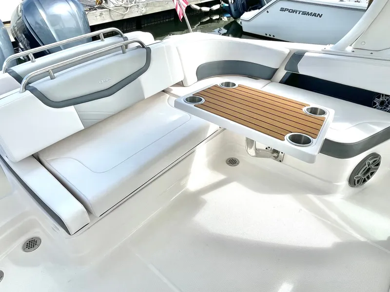 Slide: The Image of Interior of 2021 Chaparral 300 OSX with table and seating area. - 41