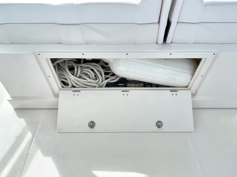 Slide: The Image of Storage compartment in Chaparral 300 OSX boat, rope and fender visible. - 49