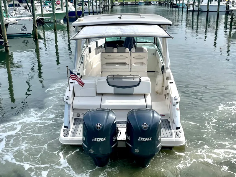 Slide: The Image of Rear view of a 2021 Chaparral 300 OSX boat in harbor. - 8
