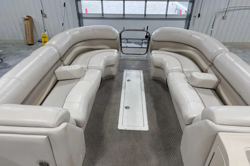 Slide: The Image of Luxurious interior of a 2005 Crest 25 Savanna pontoon boat with plush seating. - 12