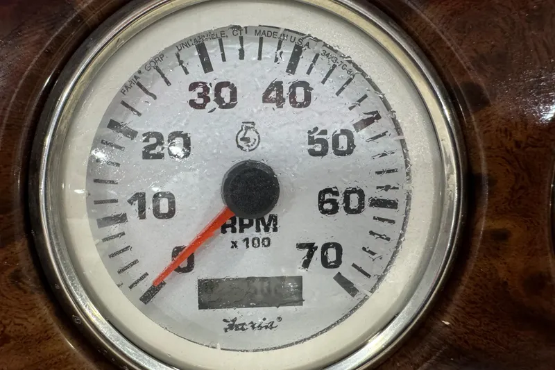 Slide: The Image of Close-up of a Faria RPM gauge on a 2005 Crest 25 Savanna boat dashboard. - 13