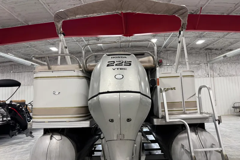 Slide: The Image of 2005 Crest 25 Savanna pontoon boat with Honda 225 VTEC engine in indoor storage. - 5