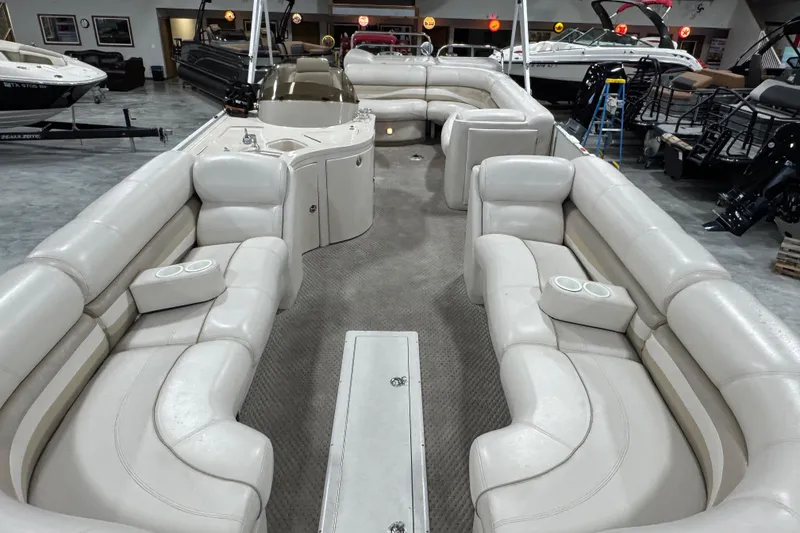 Slide: The Image of Luxurious 2005 Crest 25 Savanna pontoon boat interior with plush seating and cup holders. - 6