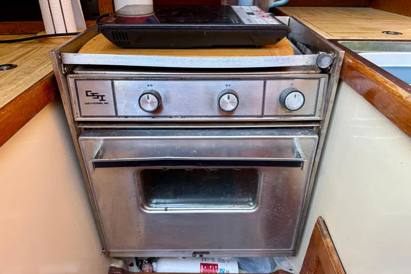Slide: The Image of Stainless steel oven in a 1985 Catalina 38 yacht kitchen. - 17