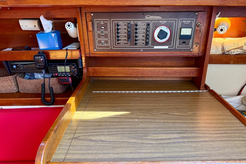 Slide: The Image of Control panel of a 1985 Catalina 38 sailboat with radio and electrical switches. - 21