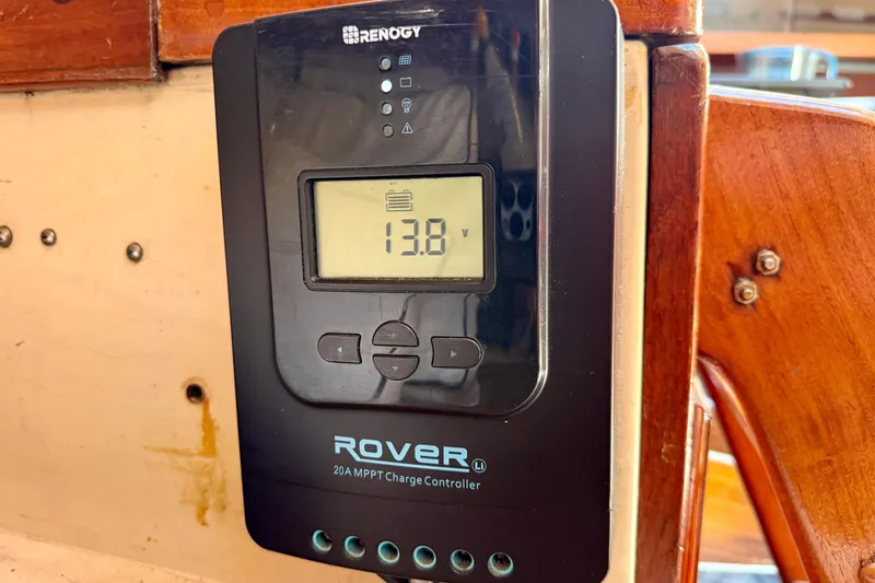 Slide: The Image of Renogy Rover charge controller displaying 13.8V on a 1985 Catalina 38 sailboat. - 24