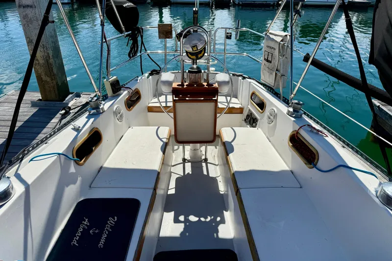 Slide: The Image of Cockpit of a 1985 Catalina 38 sailboat docked at a marina. - 9