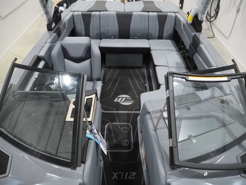 Slide: The Image of Interior of 2026 Malibu Wakesetter 21 LX with gray seating. - 11