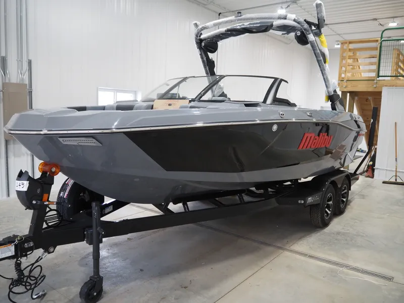 Slide: The Image of 2026 Malibu Wakesetter 21 LX boat in a warehouse. - 2
