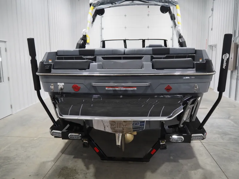 Slide: The Image of Rear view of 2026 Malibu Wakesetter 21 LX in a garage. - 3