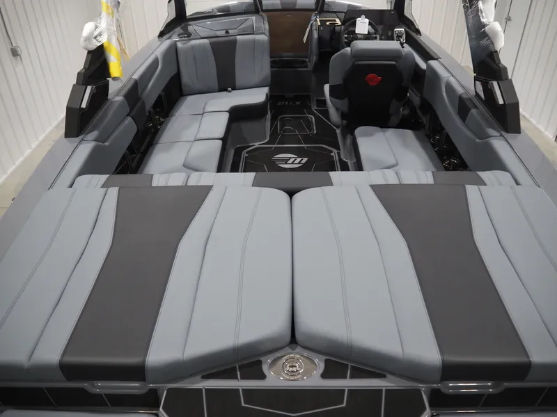 Slide: The Image of 2026 Malibu Wakesetter 21 LX interior with gray upholstery. - 4