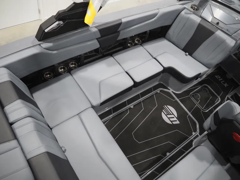 Slide: The Image of 2026 Malibu Wakesetter 21 LX interior with gray upholstery. - 5