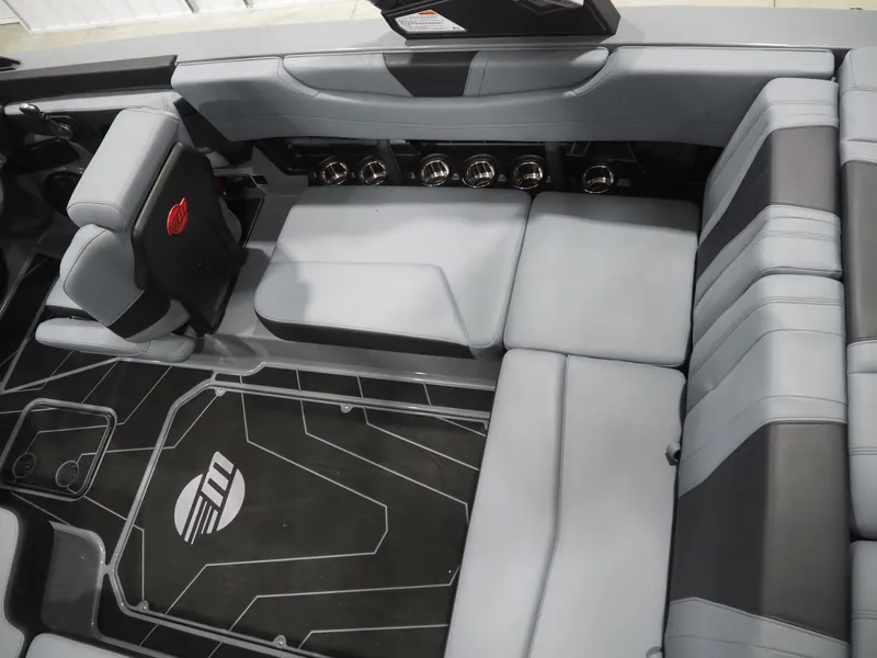 Slide: The Image of 2026 Malibu Wakesetter 21 LX interior with gray upholstery. - 6