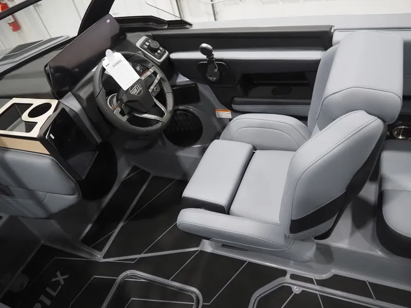 Slide: The Image of Interior of 2026 Malibu Wakesetter 21 LX with gray seating. - 8