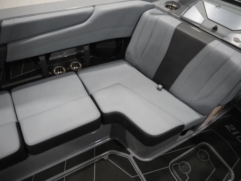 Slide: The Image of Interior of 2026 Malibu Wakesetter 21 LX with gray upholstered seats. - 9