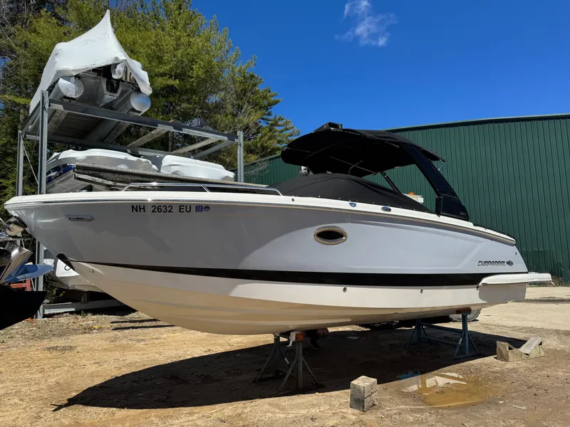 The Image of 2023 Chaparral 287 SSX boat on stands outdoors. - 1