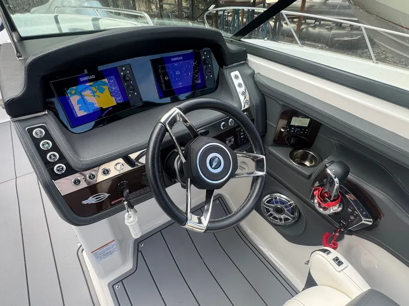 Slide: The Image of 2023 Chaparral 287 SSX cockpit with advanced navigation system. - 11