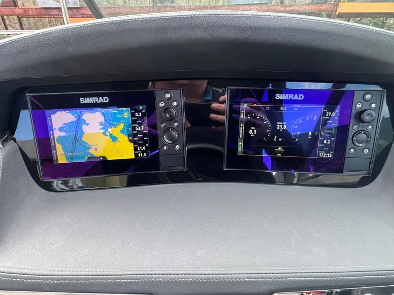 Slide: The Image of Simrad displays on Chaparral 287 SSX 2023 dashboard. - 12