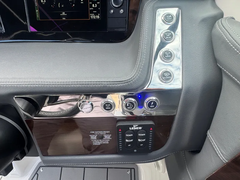 Slide: The Image of Dashboard of 2023 Chaparral 287 SSX with control buttons. - 14