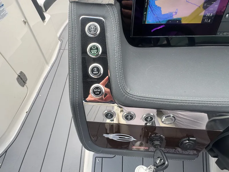Slide: The Image of Dashboard of 2023 Chaparral 287 SSX with control buttons. - 16