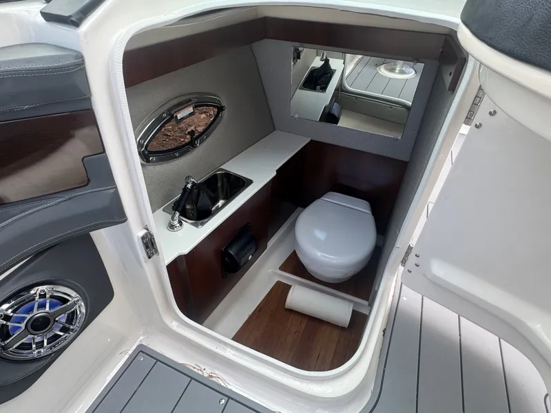 Slide: The Image of Interior of 2023 Chaparral 287 SSX with toilet and sink. - 18