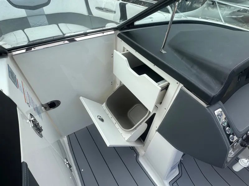 Slide: The Image of Interior of 2023 Chaparral 287 SSX featuring storage compartments. - 19