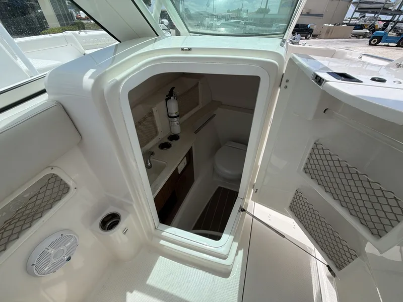 Slide: The Image of Interior of 2022 Sailfish 245 DC featuring toilet and sink. - 4