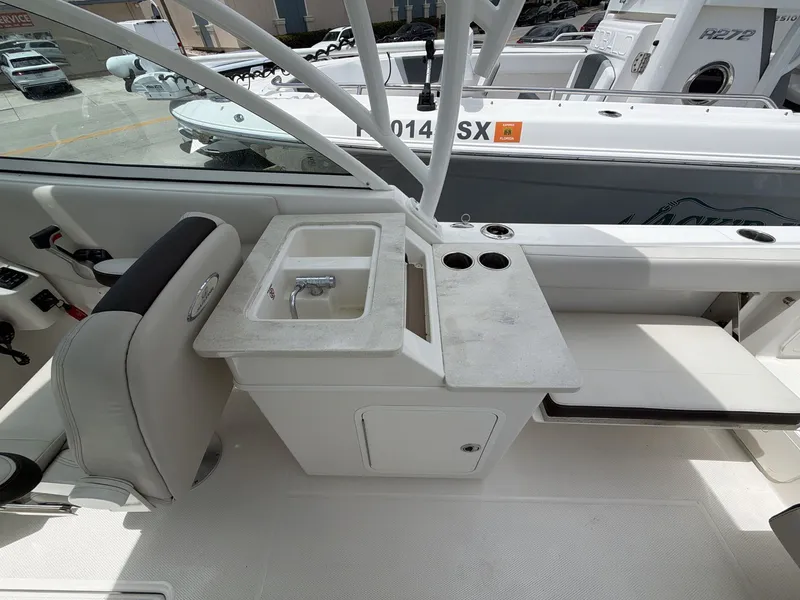 Slide: The Image of Interior of 2022 Sailfish 245 DC with sink and seating area. - 5