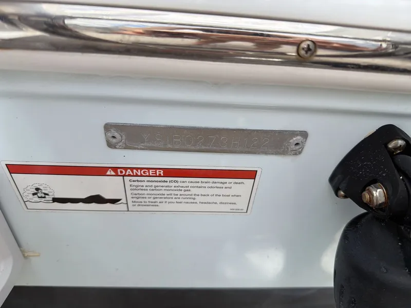 Slide: The Image of Sailfish 245 DC 2022 boat with warning label and serial number. - 6