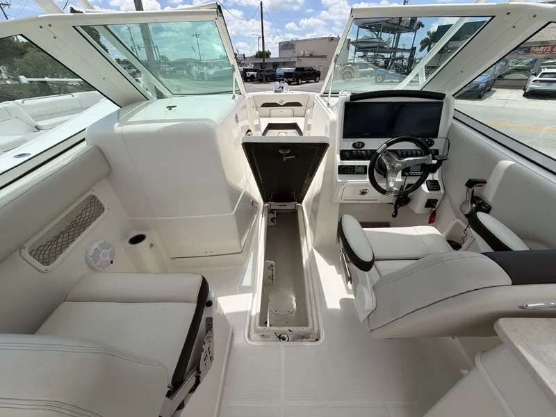 Slide: The Image of Interior of a 2022 Sailfish 245 DC boat with helm station. - 8
