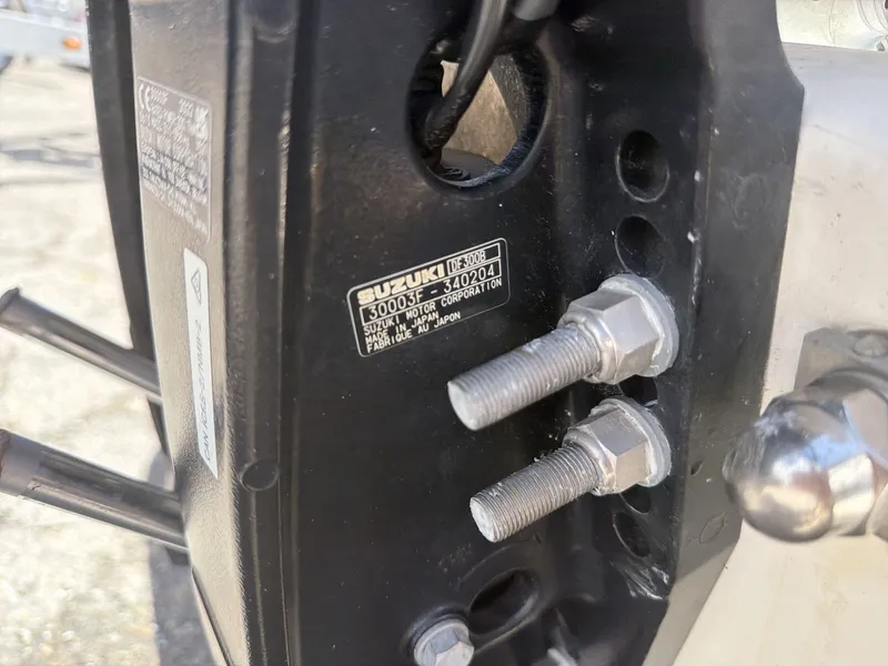 Slide: The Image of Close-up of a Suzuki engine part with serial number. - 6