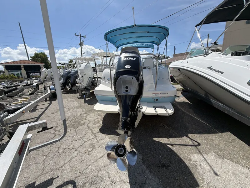 Slide: The Image of 2023 Splender 259 Sunstar boat with outboard motor in parking lot. - 9