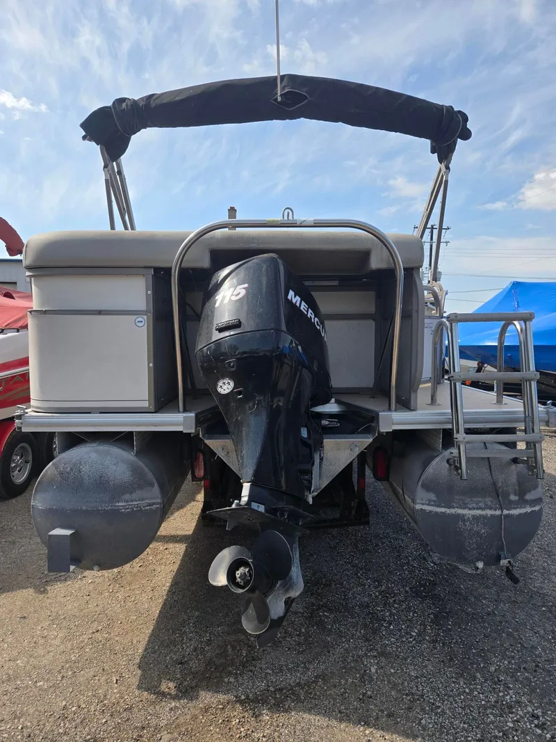 Slide: The Image of Rear view of a 2007 Starcraft Majestic 256 pontoon boat with outboard motor. - 5