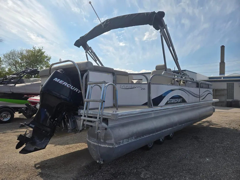 Slide: The Image of 2007 Starcraft Majestic 256 pontoon boat with Mercury outboard motor. - 6