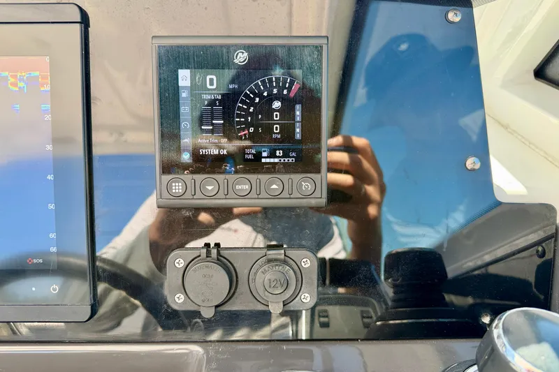 Slide: The Image of Dashboard of 2023 Blackfin 272 DC boat with digital display and controls. - 18