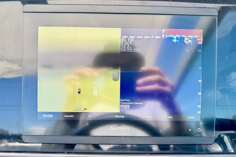 Slide: The Image of Garmin marine display on 2023 Blackfin 272 DC boat, showing navigation and sonar data. - 19