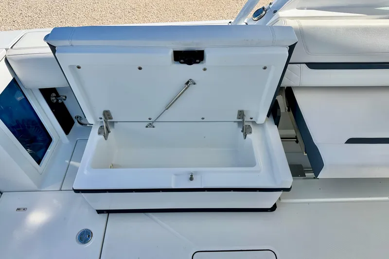 Slide: The Image of Open storage compartment on 2023 Blackfin 272 DC boat, showcasing interior space. - 32