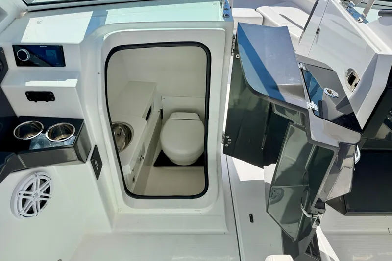 Slide: The Image of 2023 Blackfin 272 DC boat interior with compact bathroom and modern amenities. - 36