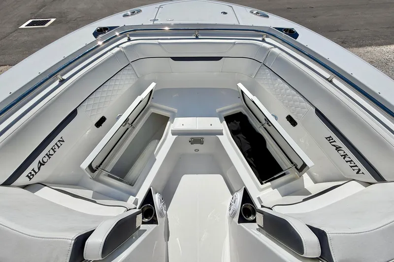 Slide: The Image of 2023 Blackfin 272 DC boat interior with open storage compartments and seating. - 41