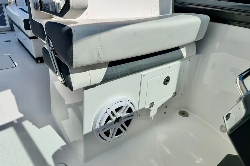 Slide: The Image of 2023 Blackfin 272 DC boat interior with cushioned seating and speaker system. - 43