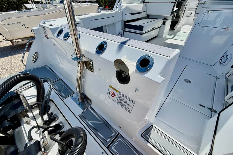 Slide: The Image of 2023 Blackfin 272 DC boat interior, showcasing seating and deck features. - 46