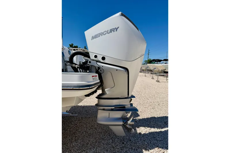Slide: The Image of 2023 Blackfin 272 DC boat with Mercury outboard engine on gravel lot. - 50