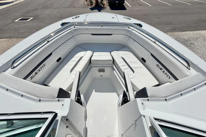 Slide: The Image of 2023 Blackfin 272 DC boat interior with white seating and sleek design. - 8