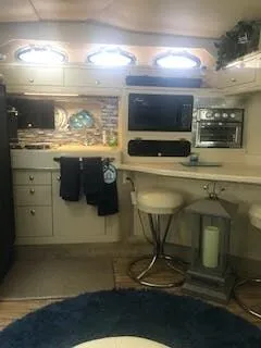 Slide: The Image of Interior of a 1999 Sea Ray Sundancer yacht with modern kitchen. - 12