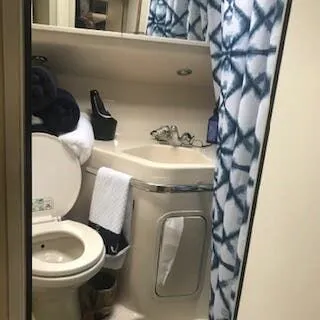 Slide: The Image of Bathroom of a 1999 Sea Ray Sundancer yacht with shower and toilet. - 14