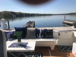 Slide: The Image of 1999 Sea Ray Sundancer with stylish deck and lake view. - 6